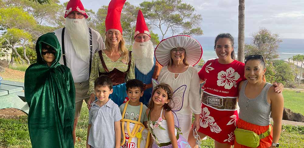 familiy dressed in costume for Waialae Iki Fall Festival.